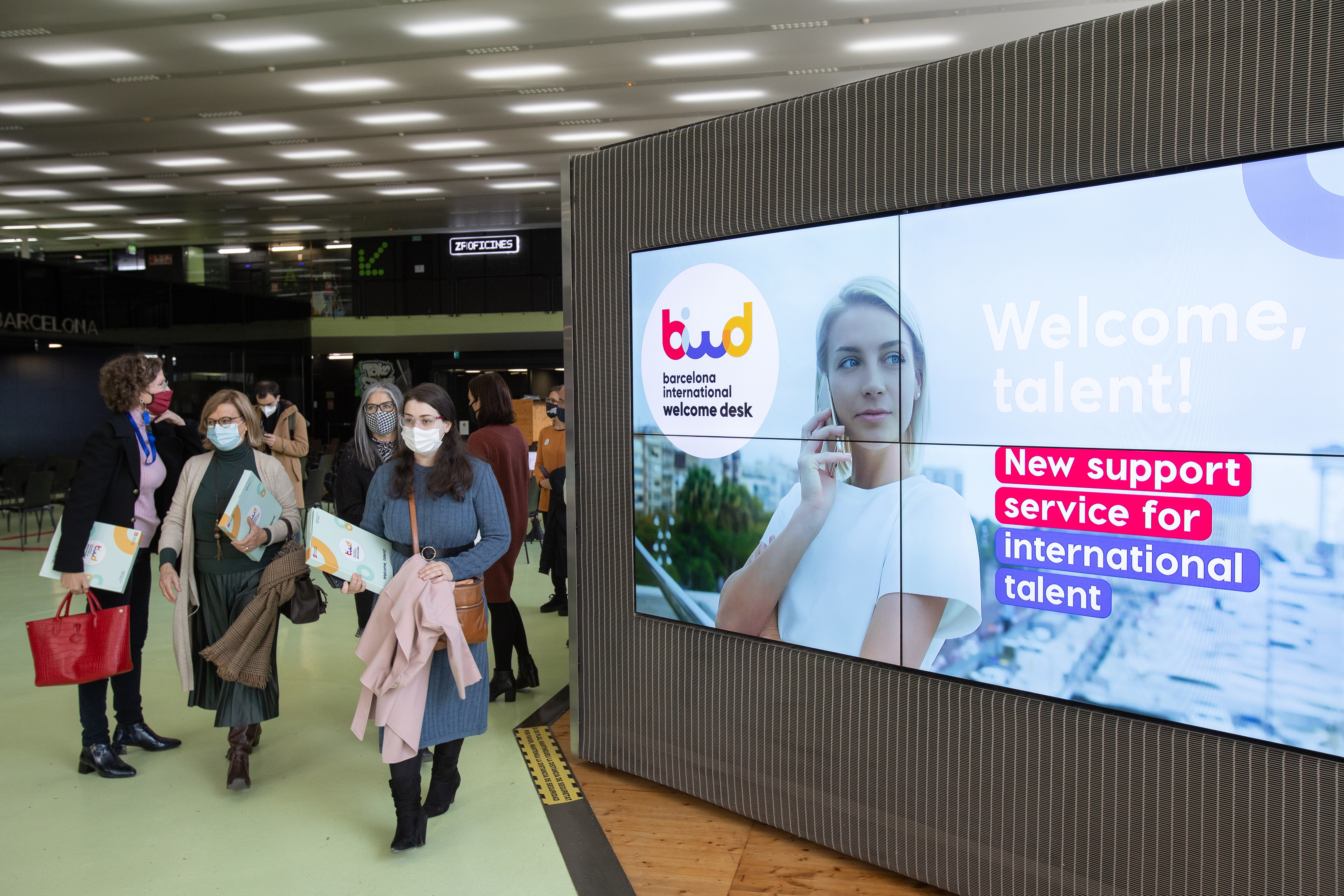 One of the screens with information about the new Barcelona International Welcome Desk office